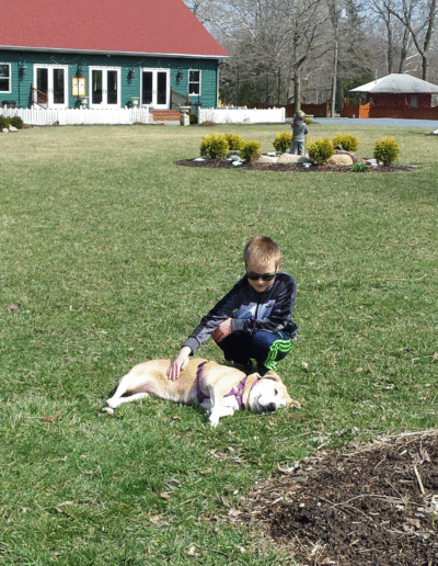 Lucy the beagle mix with a child