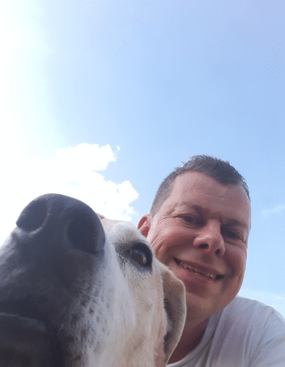 Lucy the beagle mix with her human, Mark