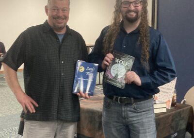Mark with author Connor Freeman at Marion Public Library inaugural author fair, Harvesting Our Stories, on November 15, 2025.