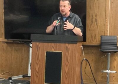 Mark speaking to guests and other authors about his debut memoir Lucy's Way at the Marion Public Library's inaugural Harvesting Our Stories local author fair on November 15, 2025.