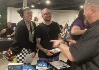 Mark talks with book connoisseurs at the Bookworm Orchard grand opening author signing event in Marion, Indiana on April 25, 2026.