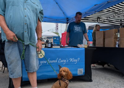 A furry friend striking a pose in front of the Lucy's Way tent at Mama Pearson's Spring Market on May 16, 2026.