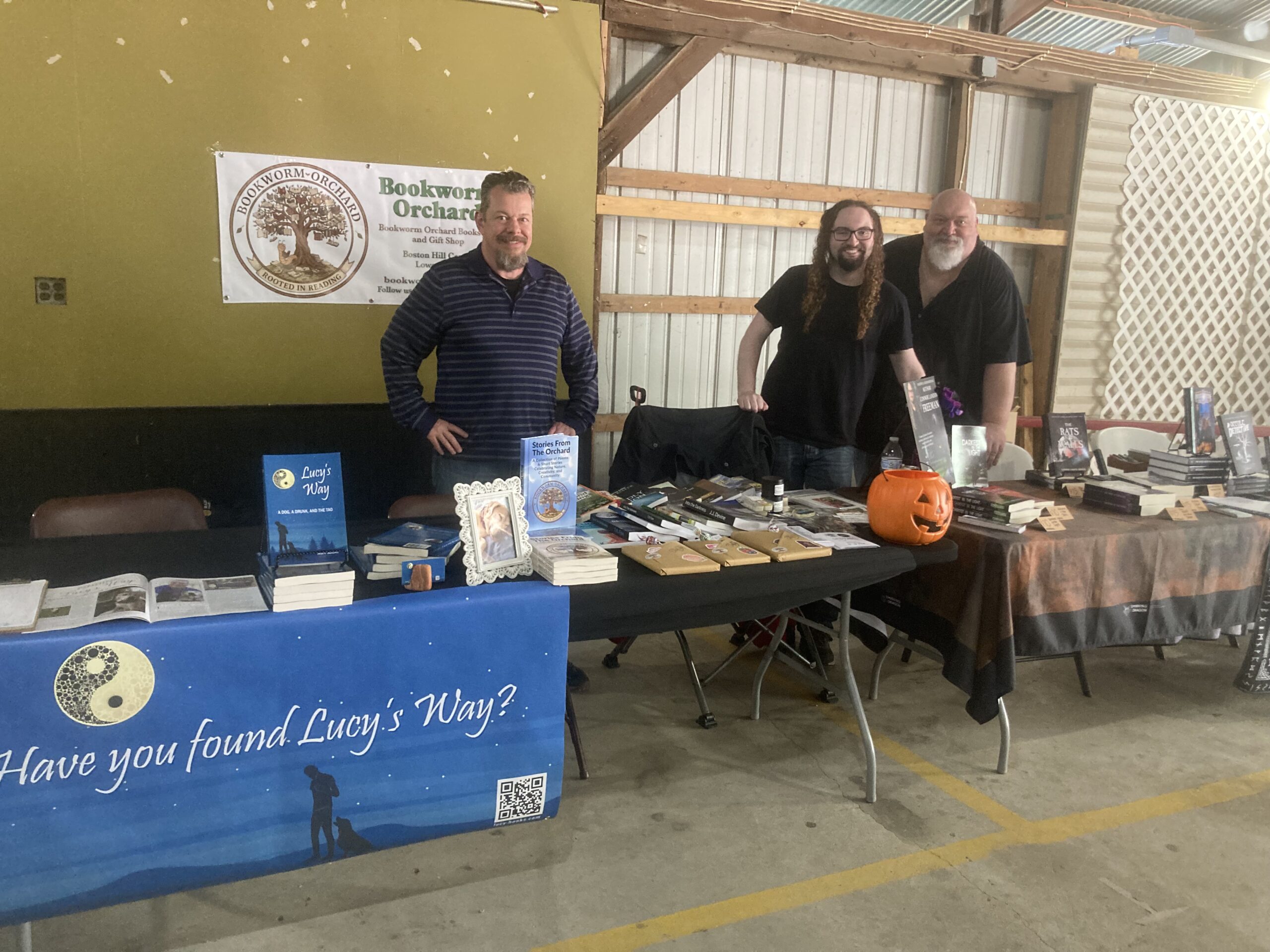 Mark with authors Connor Landon Freeman, center, and Bob Freeman representing Bookworm Orchard at May 23, 2026 Summerween event at Cass County Fairgrounds in Logansport, IN.