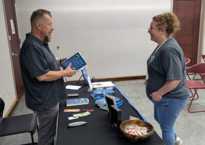 Mark talks with Elwood Library's Wendy Rivera after reading from Lucy's Way on August 8, 2026.