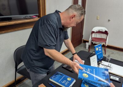 Mark signs copies of Lucy's Way at Elwood Public Library on August 8, 2026.